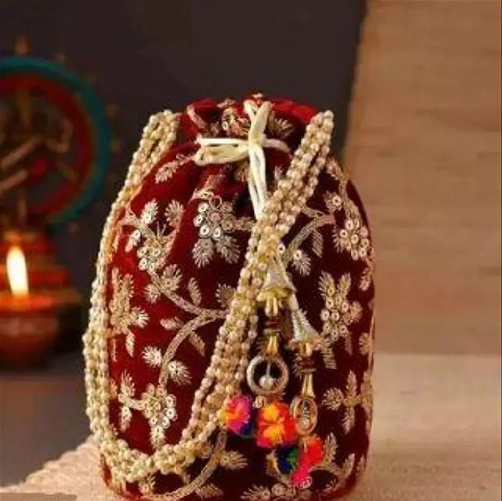 Maroon velvet embroidered potli bag with pearl handle